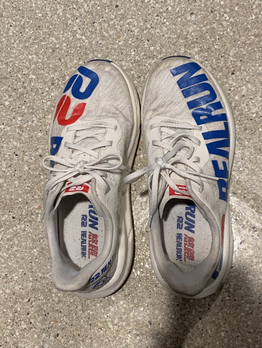 #717 White RUN sneakers with bold blue & red lettering